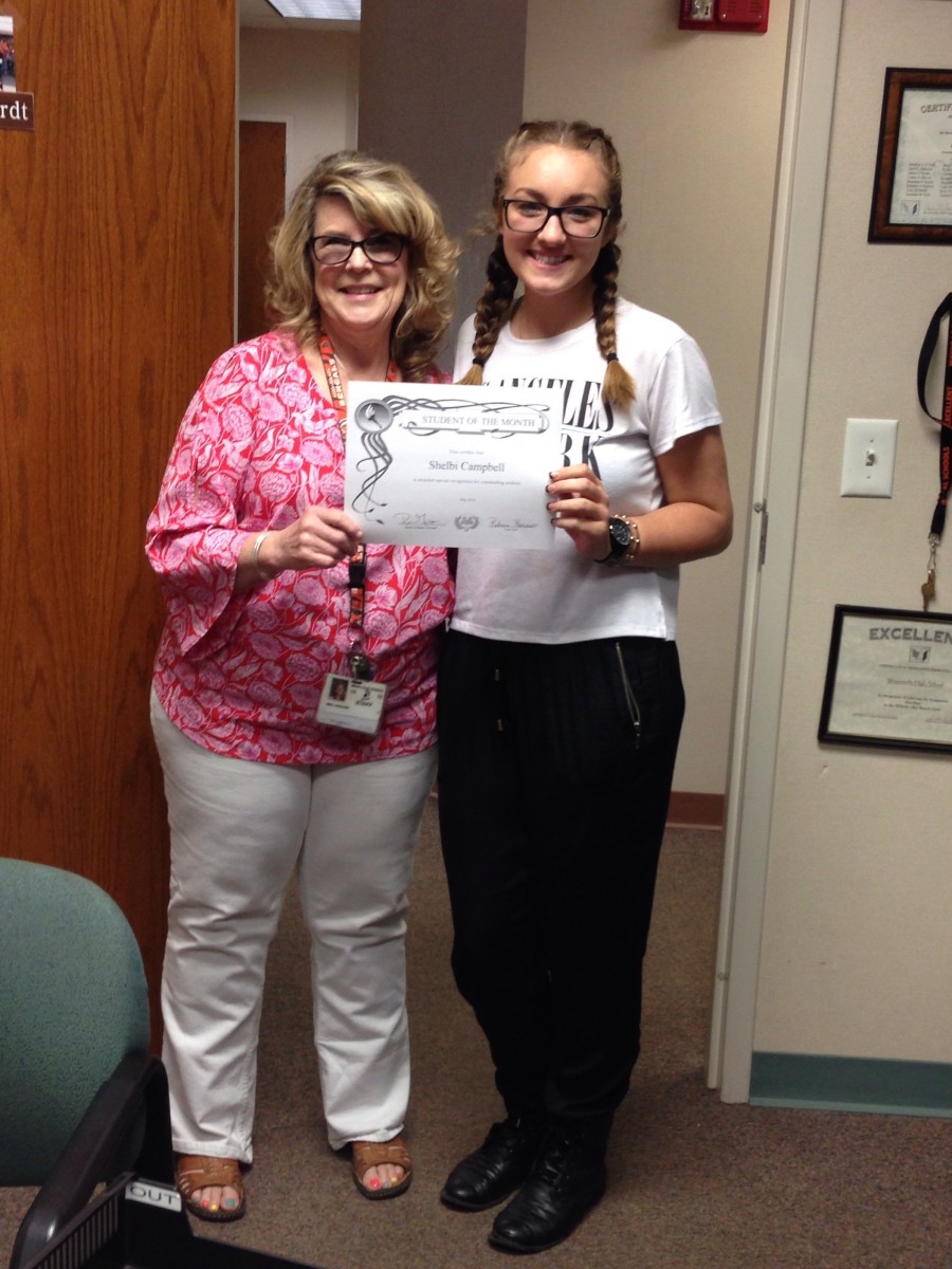 mage of two people holding a certificate